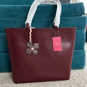 Kate Spade Cherrywood medium tote with Floral Charm